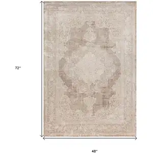 Photo of Beige and Ivory Medallion Area Rug