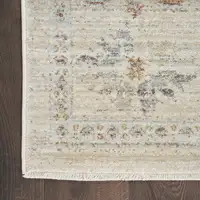 Photo of Beige and Ivory Oriental Power Loom Distressed Area Rug With Fringe