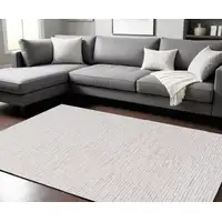 Photo of Beige and Ivory Wool Striped Hand Tufted Area Rug