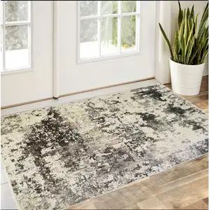 Photo of Black Abstract Distressed Area Rug With Fringe