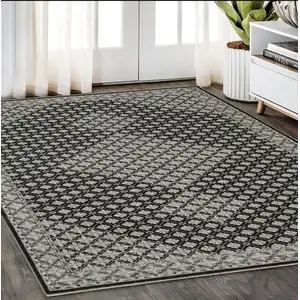 Photo of Black And Gray Diamond Area Rug With Fringe