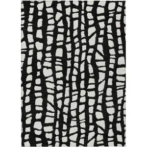 Photo of Black And Ivory Abstract Washable Indoor Outdoor Area Rug