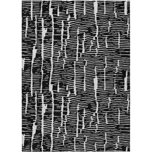 Photo of Black And Ivory Abstract Washable Indoor Outdoor Area Rug