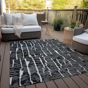 Photo of Black And Ivory Abstract Washable Indoor Outdoor Area Rug