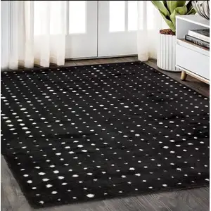 Photo of Black And Ivory Geometric Area Rug