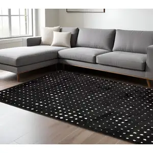 Photo of Black And Ivory Geometric Area Rug