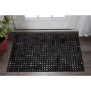 Photo of Black And Ivory Geometric Area Rug