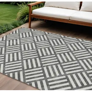 Photo of Black And Ivory Geometric Washable Indoor Outdoor Area Rug