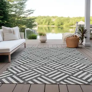 Photo of Black And Ivory Geometric Washable Indoor Outdoor Area Rug