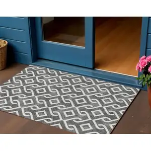 Photo of Black And Ivory Geometric Washable Indoor Outdoor Area Rug