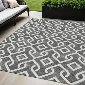 Photo of Black And Ivory Geometric Washable Indoor Outdoor Area Rug