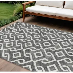 Photo of Black And Ivory Geometric Washable Indoor Outdoor Area Rug