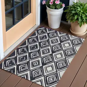 Photo of Black And Ivory Geometric Washable Indoor Outdoor Area Rug