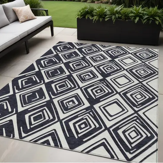 Black And Ivory Geometric Washable Indoor Outdoor Area Rug Photo 1