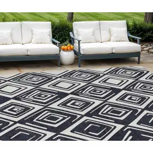 Photo of Black And Ivory Geometric Washable Indoor Outdoor Area Rug