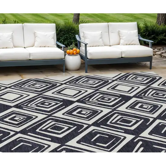 Black And Ivory Geometric Washable Indoor Outdoor Area Rug Photo 1