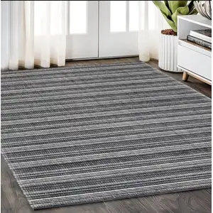 Photo of Black And Ivory Striped Hand Tufted Area Rug