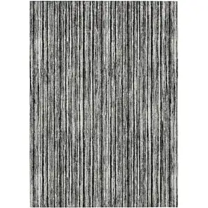 Photo of Black And Ivory Striped Washable Indoor Outdoor Area Rug