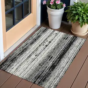 Photo of Black And Ivory Striped Washable Indoor Outdoor Area Rug