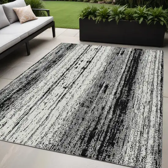 Black And Ivory Striped Washable Indoor Outdoor Area Rug Photo 1