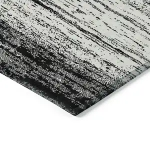 Photo of Black And Ivory Striped Washable Indoor Outdoor Area Rug