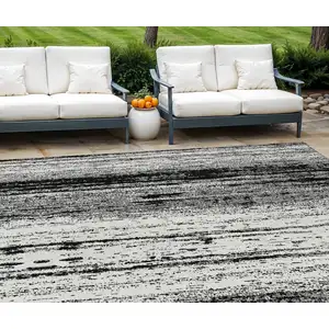 Photo of Black And Ivory Striped Washable Indoor Outdoor Area Rug