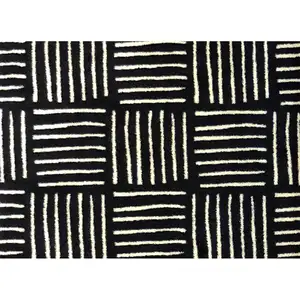 Photo of Black And Off White Abstract Machine Washable Area Rug With UV Protection