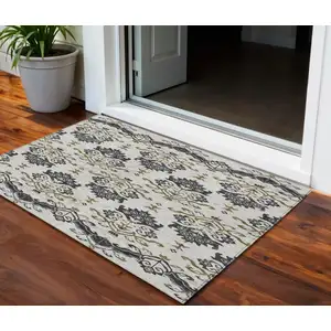 Photo of Black Beige And Gold Oriental Washable Indoor Outdoor Area Rug