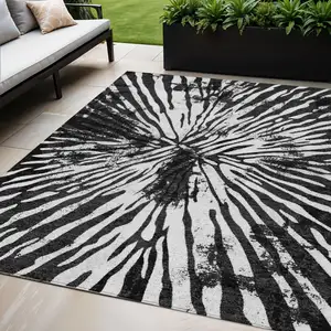 Photo of Black Charcoal And Ivory Abstract Washable Indoor Outdoor Area Rug