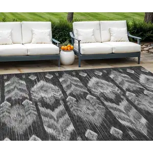 Photo of Black Charcoal And Silver Southwestern Washable Indoor Outdoor Area Rug