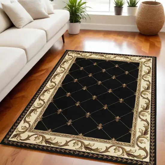 Black and Tan Fleur de Lis Diamond Border Area Rug Photo 1