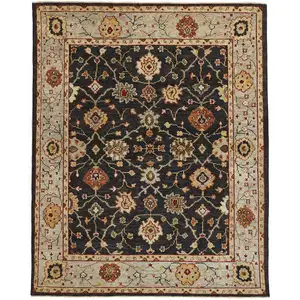 Photo of Black Gold And Gray Wool Floral Hand Knotted Stain Resistant Area Rug With Fringe