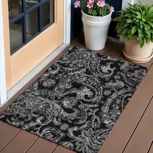 Photo of Black Gray And Charcoal Paisley Washable Indoor Outdoor Area Rug