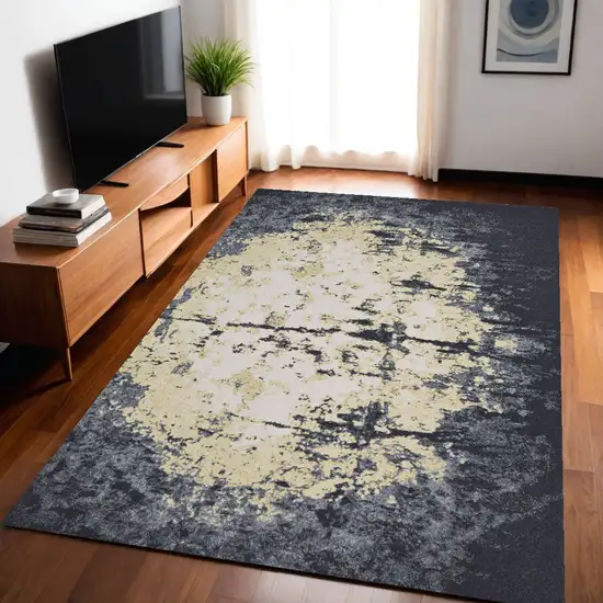 Black Gray And Gold Geometric Stain Resistant Area Rug Photo 1