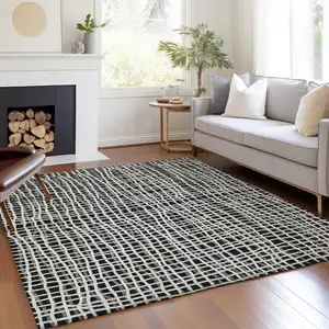 Photo of Black Gray And Ivory Striped Washable Indoor Outdoor Area Rug