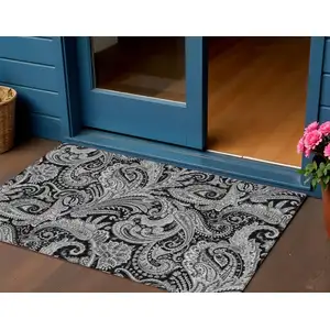 Photo of Black Gray And White Paisley Washable Indoor Outdoor Area Rug