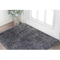 Photo of Black Gray and Ivory Abstract Hand Woven Area Rug