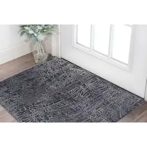 Photo of Black Gray and Ivory Abstract Hand Woven Area Rug