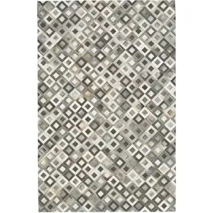 Photo of Black Gray and White Faux Cowhide Animal Print Power Loom Area Rug