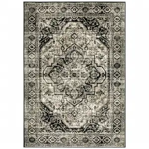 Photo of Black Grey Tan And Ivory Oriental Power Loom Stain Resistant Area Rug