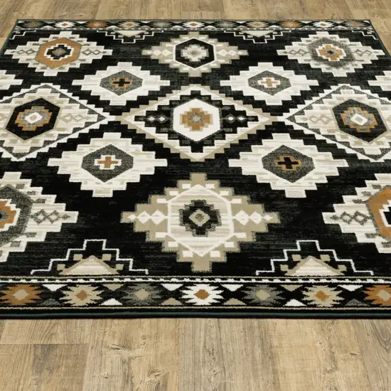 Black Grey Tan Orange And Ivory Southwestern Power Loom Stain Resistant Area Rug Photo 6