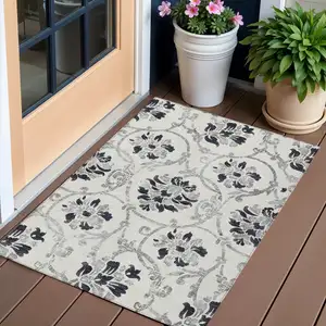 Photo of Black Silver And Charcoal Floral Washable Indoor Outdoor Area Rug