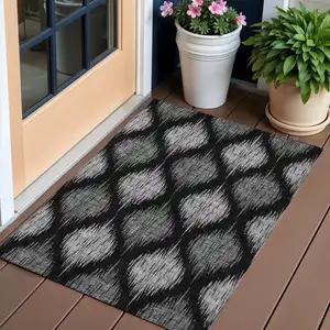 Photo of Black Silver And Gray Ikat Washable Indoor Outdoor Area Rug