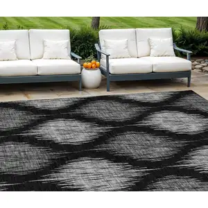 Photo of Black Silver And Gray Ikat Washable Indoor Outdoor Area Rug