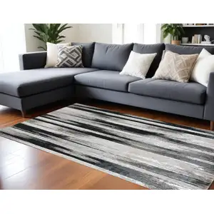 Photo of Black Silver and Gray Abstract Power Loom Area Rug