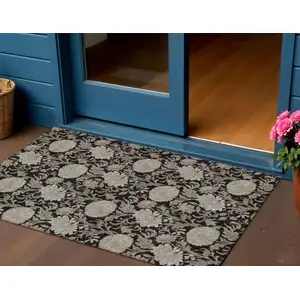 Photo of Black Taupe And Beige Floral Washable Indoor Outdoor Area Rug