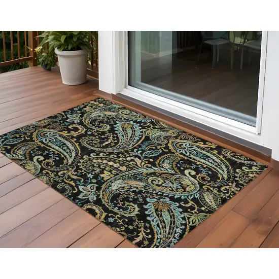 Black and Gold Paisley Washable Indoor Outdoor Area Rug Photo 1