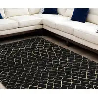 Photo of Black and Ivory Abstract Power Loom Distressed Area Rug