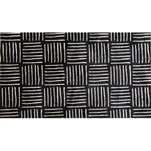 Photo of Black and Off White Abstract Machine Tufted Washable Area Rug With UV Protection