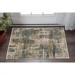 Photo of Blue And Gold Abstract Area Rug With Fringe